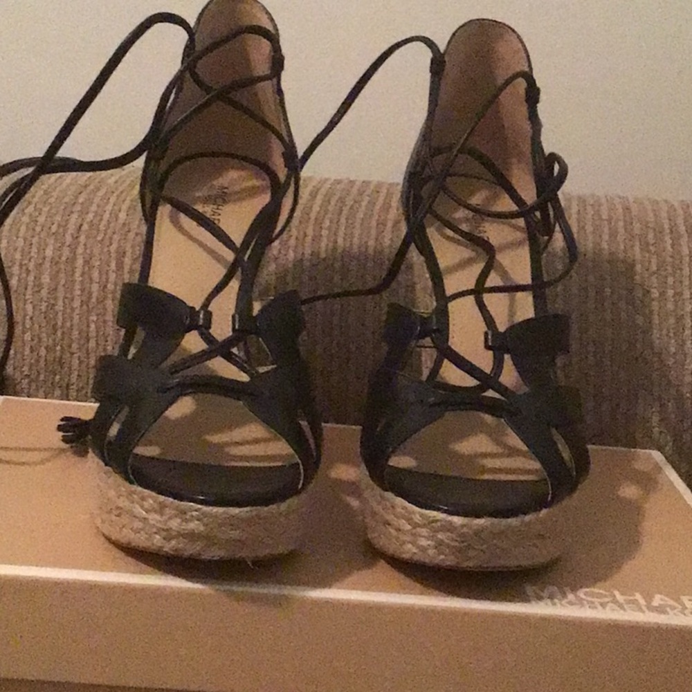 Wedge strapped shoe.never worn slight scuff marks on top left shoe.